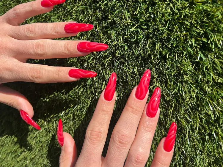 Bold red stiletto nails classic manicure