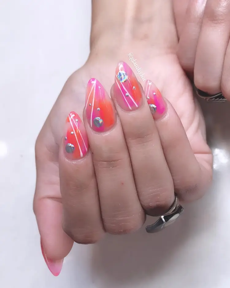 Coral ombre nails with gem accents